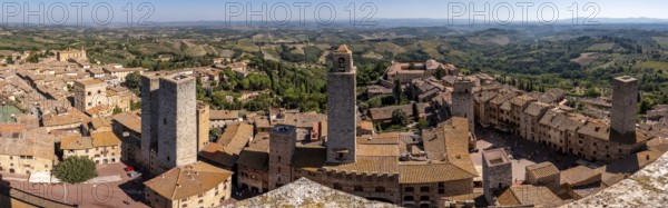 Wide panoramic view over downtown San Gimignano, Torri dei Salvucci and Torre Rognosa in the