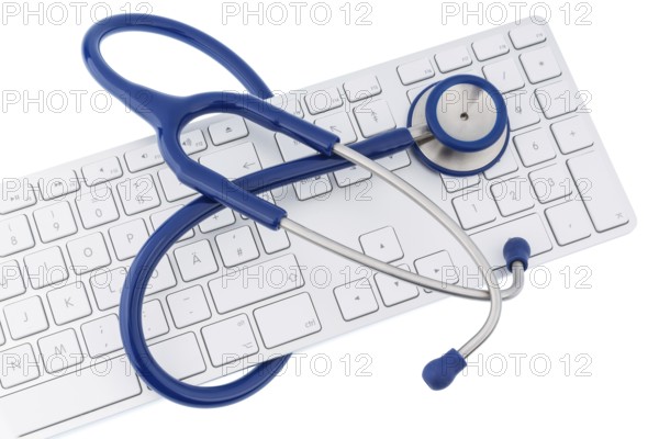 Stethoscope and keyboard of a computer, symbolic photo for diagnostics and appointment management
