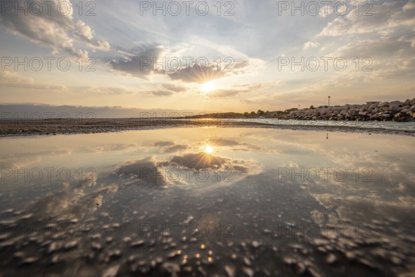 Bay with a small jetty or pier in the morning. Beautiful sunrise on the Mediterranean.