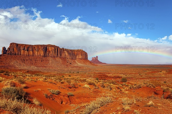 Navajo Indian Reservations. USA. Monument Valley Sentinel Mesa and the bright rainbow. Monument