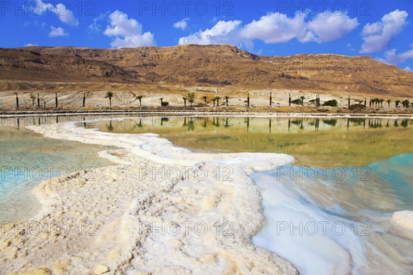 Therapeutic Dead Sea, Israel. The evaporated salt is precipitated by picturesque stripes in shallow