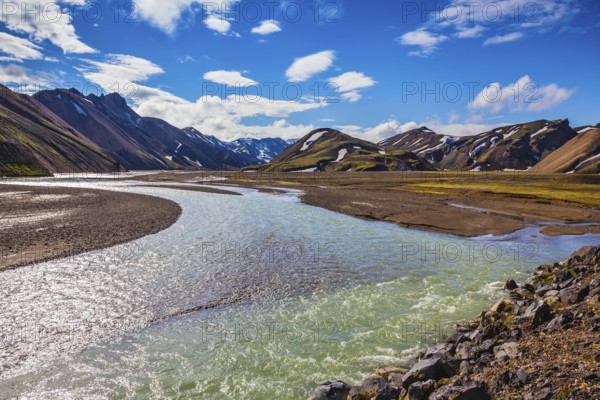The picturesque valley in the national park Landmannalaugar, Iceland. Summer flood of meltwater