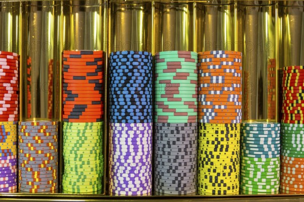 Colourful roulette chips in a casino on a gambling table. Lots of chips with different nomination
