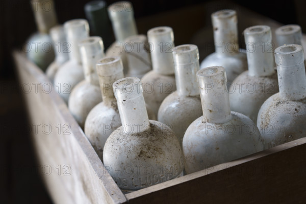 Old empty bottles, essences for alcoholic beverages, old Ripoll winery, Llucmajor, Majorca,