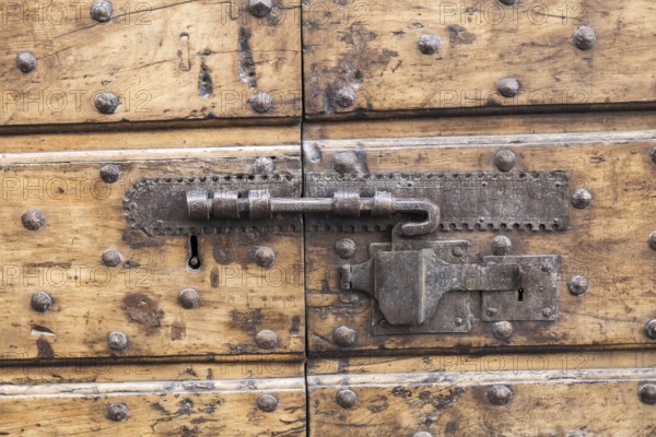 Close up of rustic old door in Spoleto, Italy