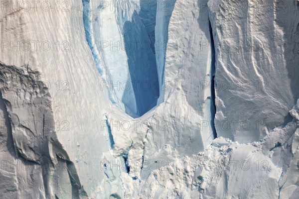 Close-up of a glacier with impressive ice formations and cool blue tones, The eternal ice of