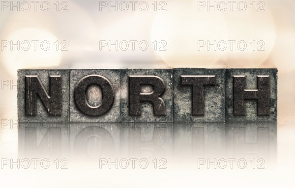 The word NORTH written in vintage ink stained letterpress type