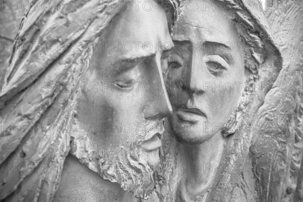 Bas-relief in bronze representing The Pity of Michelangelo. Faces of Holy Mary mother and Jesus