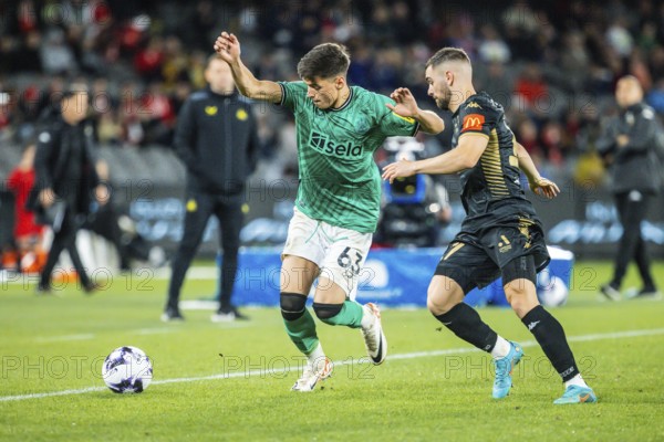 MELBOURNE, AUSTRALIA, MAY 24: Ben Parkinson of Newcastle United competes with Benjamin Garuccio of