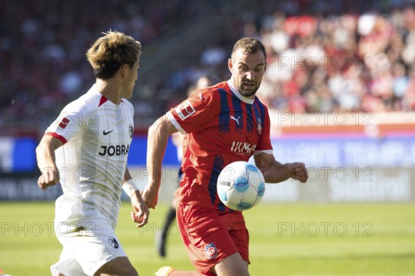 Football match, Ritsu DOAN SC Freiburg left in a duel for the ball with Benedikt GIMBER 1.FC