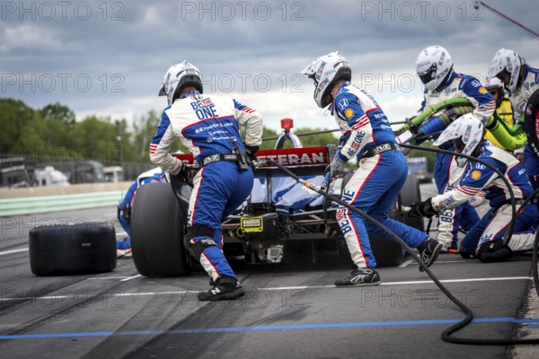 LINUS LUNDQVIST (R) (8) of Stockholm, Sweden comes down pit road for service during the XPEL Grand