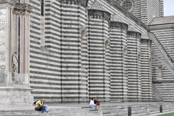 The Cathedral Basilica of Santa Maria Assunta, Orvieto, Terni, Umbria, Italy, People sitting in