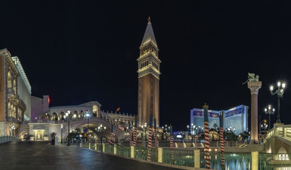 A picture of the Venetian Las Vegas at night, with the Rialto Bridge on the left and the Campanile