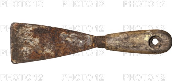An old rusty and dirty putty knife isolated