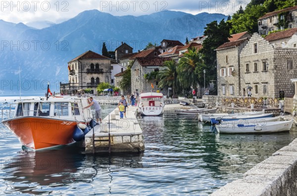 PERAST, MONTENEGRO, JUNE 18: View on embankment and boats in old town on June 18, 2014 in Perast,