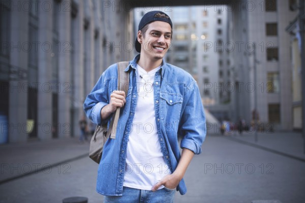 Background on the street while waiting his colleagues. Businessman wearing casual white shirt and