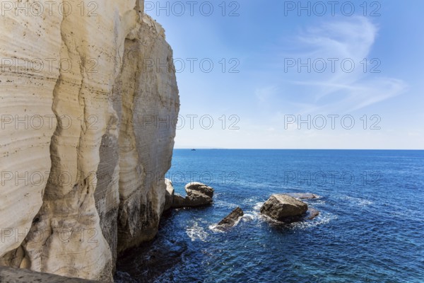 Israel. The color of sea water changes from azure to dark blue. Karst cave Rosh-a-Nikra on the