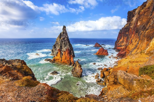 The blinding midday sun illuminates the rocky shore. Madeira is a magical island in the Atlantic.