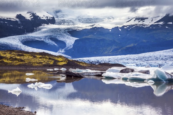 The grand glacier Vatnajokull is melting at the edges, sliding to the ocean. Glacier meltwater form