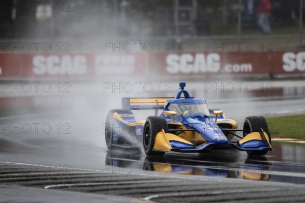 KYFFIN SIMPSON (R) (4) of Bridgetown, Barbados drives on track during practice for the XPEL Grand