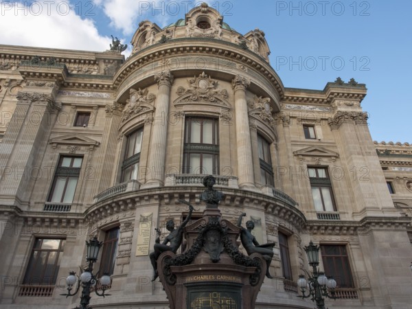 Fascinating front view of a magnificent opera house with richly decorated façade elements and