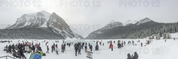 Lake Louise, Alberta, Canada. Jan 29, 2024. A panoramic scene capturing individuals engaged in ice