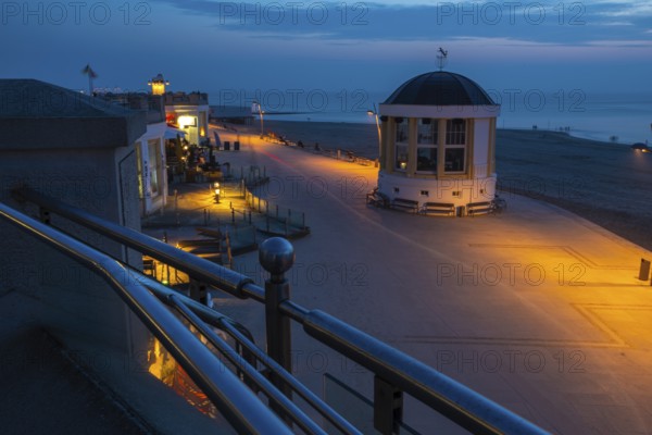 Seaside walk in Borkum town at night with Music Pavilion and lights. Seaside walk in Borkum town at