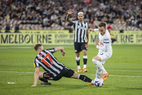 MELBOURNE, AUSTRALIA, MAY 22: James Maddison of Tottenham Hotspur sidesteps Emil Krafth of