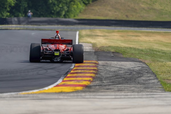 BENJAMIN PEDERSEN (R) (55) of Copenhagen, Denmark travels through the turns during a practice for