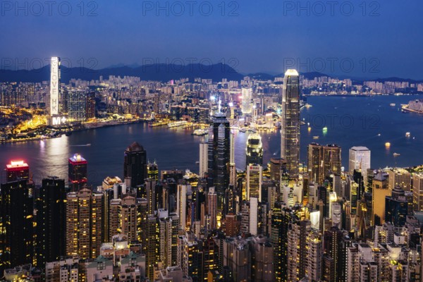 HONG KONG, CHINA - SEPTEMBER 29, 2024: Iconic view around sunset from Lugard Rd Lookout which