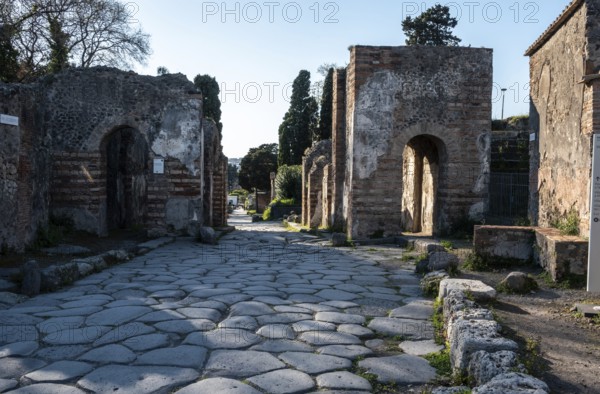 POMPEII, ITALY, MAY 04, 2022, A beautiful typical cobbled street in the ancient city of Pompeii,