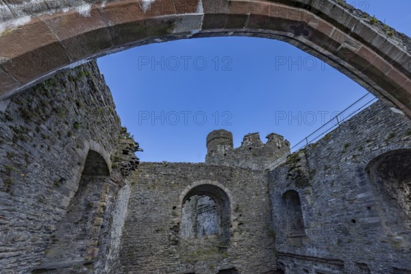 Conwy Castle, ruined stone walls and arch of the castle with a view of the sky, Conwy, Wales, Great