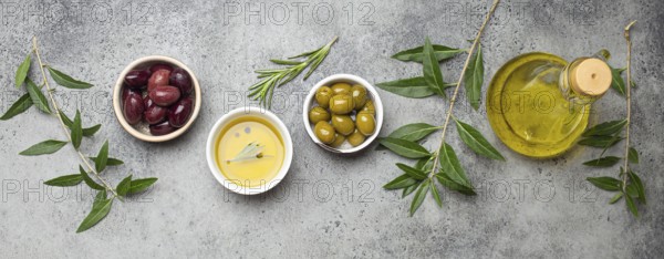 Composition with green and brown olives, extra virgin olive oil in glass bottle, olive tree