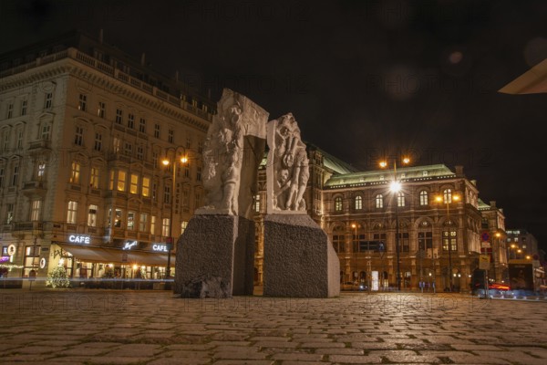 Memorial against war and fascism, monument by Alfred Hrdlicka, behind the opera, night shot,