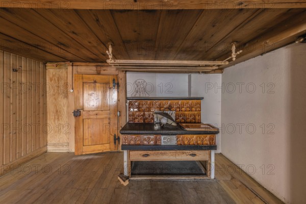 The living room with tiled stove in a house built around 1750 that has since been demolished.