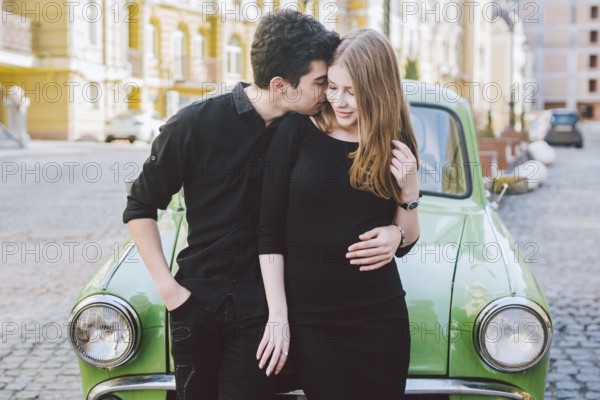 Young multiracial couple, male and female lovers heterosexual people students. Beautiful models