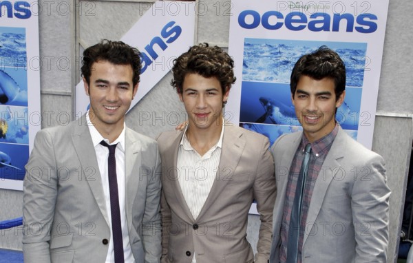 Nick Jonas, Kevin Jonas and Joe Jonas of The Jonas Brothers at the Los Angeles premiere of 'Oceans'
