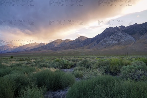 Mountain range with clouded colorful sunset, Eastern Sierra Nevada Mountains, Mono County,
