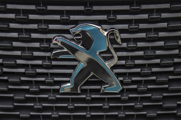 WETZLAR, Germany 2022-04-23: Peugeot logo closeup on a car grill. Peugeot as car manufacturer was