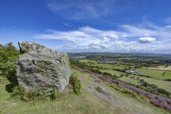 View from the mountains to Conwy Castle, medieval castle ruins surrounded by green fields and blue