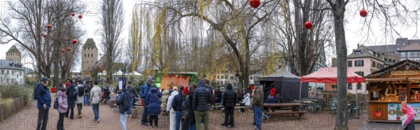 Panoramic photo Christmas market on the Louise-Weiss island square in the old town and the