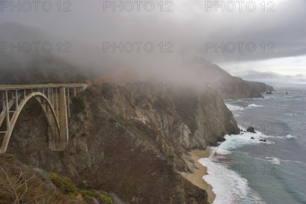 Road along Pacific coast USA and the bridge above a precipice