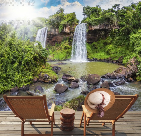 Two waterfalls from Iguazu Falls fall into a small quiet pond. The concept of ecological tourism.