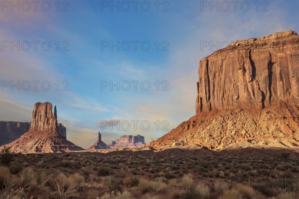 The famous cliffs Mittens in Monument Valley. The rocks - outcrops made of red sandstone. Bright