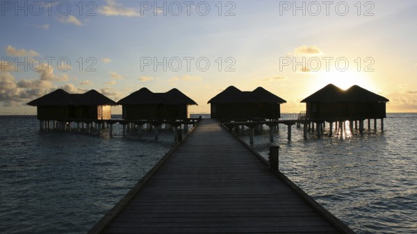Water bungalows at sunset, Kandoludu, Maldives Maldives