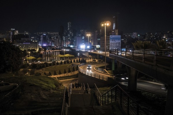 Cars drive at night on the Beirut Central Ring Road, one of the most important transport links in