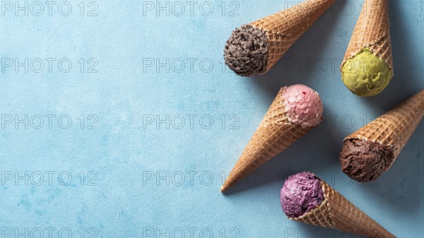 Various ice cream scoops in cones with copy space. Colorful ice cream in cones chocolate,