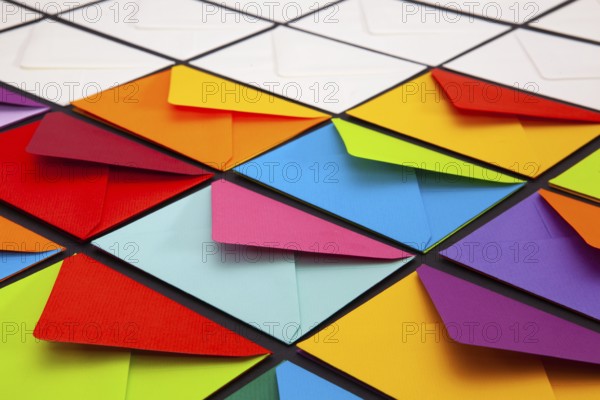 Composition with white and colored envelopes on the table. The photo suitable for various holidays