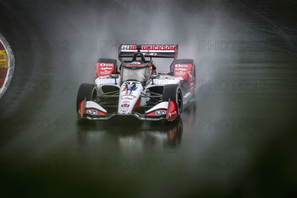 GRAHAM RAHAL (15) of New Albany, Ohio comes through turn 12 (Canada Corner) during a wet practice