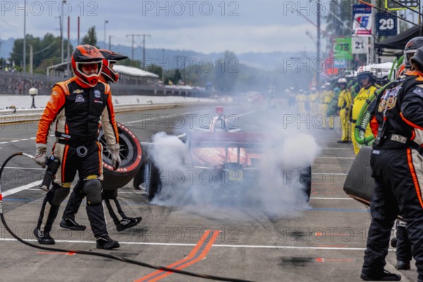 INDYCAR Series driver, BENJAMIN PEDERSEN (R) (55) of Copenhagen, Denmark, brings his car in for